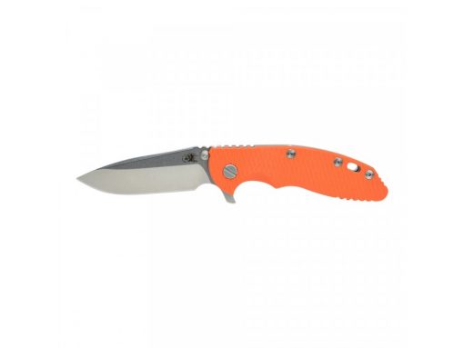 a Hinderer XM-18 3.5" Spearpoint Stonewashed with Orange G-10 that is on a white surface.