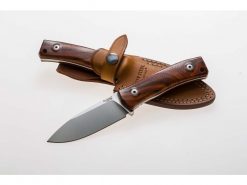 a LionSteel M4 (3.75") Satin M390 Fixed Blade Santos Wood Handle with a leather sheath on it.
