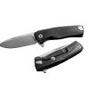The LionSteel ROK Integral Frame Lock Knife(3.2" Satin) M390 Blade Black Aluminum Handle that is on top of a table.