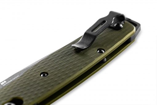 A close up of a Benchmade Bailout CPM-M4 Tanto Blade OD Green Ano Aluminum Handles on a white surface.