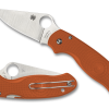 A pair of Spyderco Para 3 Lightweight Sprint REX 45 Blade Orange FRN Handle knives sitting next to each other.