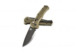 A Benchmade Claymore Auto Black D2 Combo Blade Ranger Green Grivory Handle that is laying on top of a Benchmade Claymore Auto Black D2 Combo Blade Ranger Green Grivory Handle.