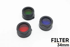Three Fenix AD302G TK-Series Green Filter Adapters on a white background.
