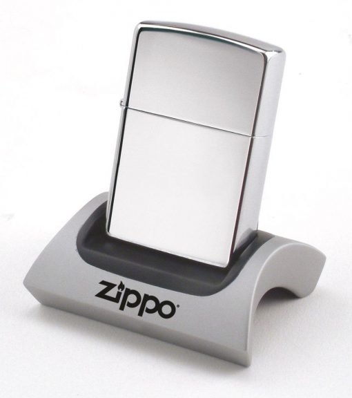 A Zippo - Magnetic Lighter Display Stand with a lighter sitting on top.