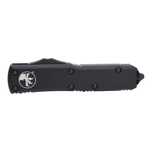 Microtech UTX-85 OTF Automatic Knife Black T/E Fully Serrated Blade Black Aluminum Handle Front Side Closed