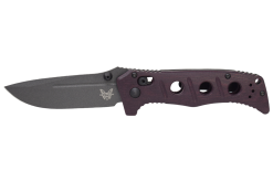 A Benchmade Mini Adamas Tungsten Grey Cerakote Blade Maroon Micarta Handle with holes in the middle of it.