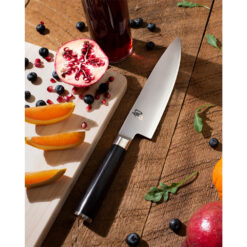 Shun Classic Chef's Knife 8 Inch Damascus VG–MAX Drop Point Fixed Blade Ebony Pakkawood Handle with Assorted Cut Fruits