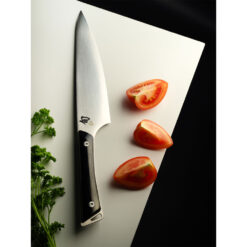 Shun Kazahana 8 Inch Satin Chef's Knife with Polished Black Pakkawood Handle with Chopped Tomato and Parsley