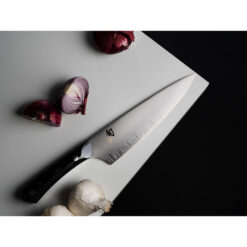 Shun Narukami Satin 8 Inch Chef's Knife Black Micarta Handle With Onions and Garlic