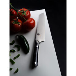 Shun Narukami Satin 6.5 Inch Master Utility Knife with Black Micarta Handles Surrounded by Peppers